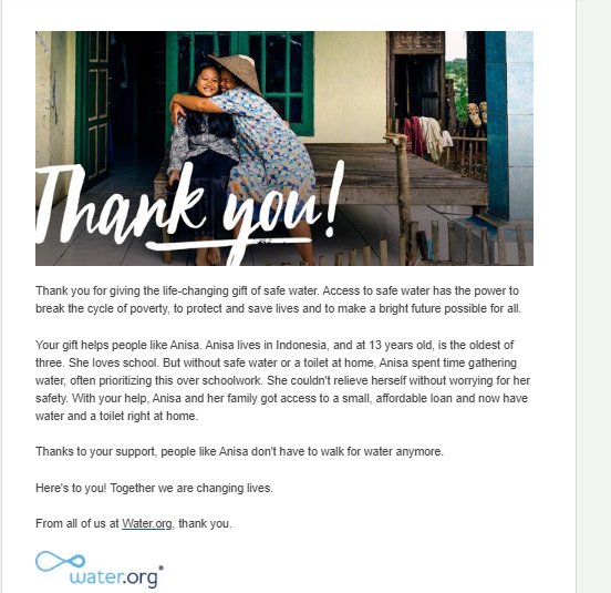 An example thank you letter for donation with a large image in the banner of people hugging.