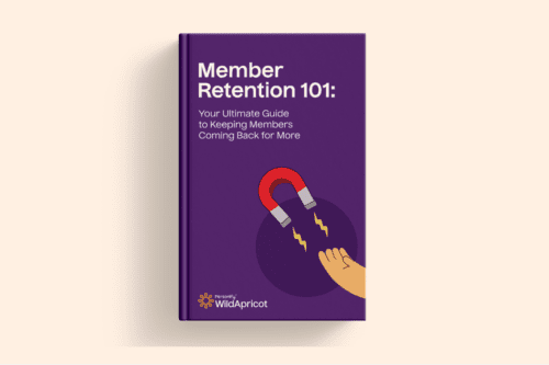 Member Retention 101 Ebook: A purple ebook cover with a magnet and hand, symbolizing retention